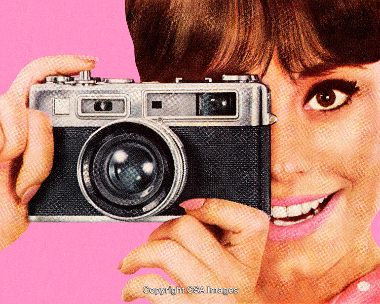 Bright Portrait Of a Smiling Woman Holding a Vintage Camera