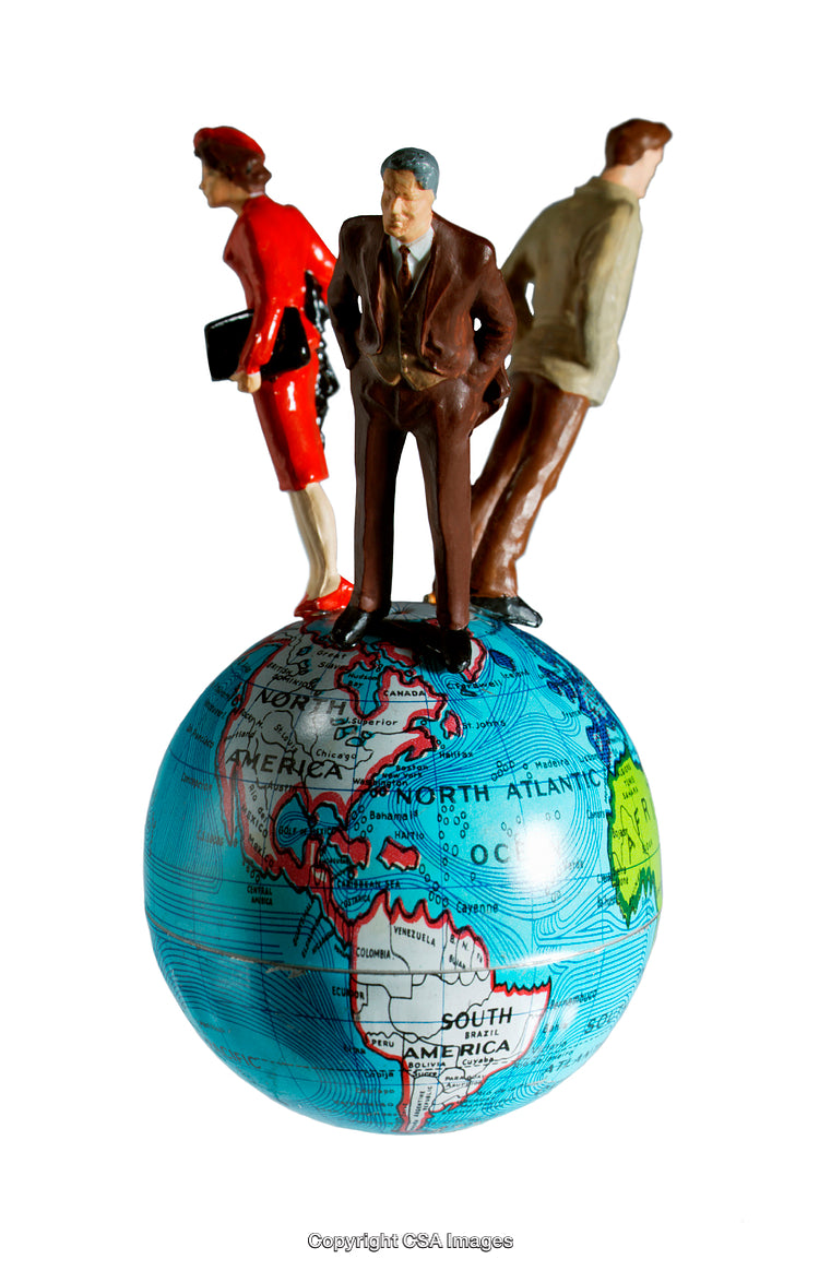 Miniature Figures Representing Business Concept Standing on a Geographic Globe