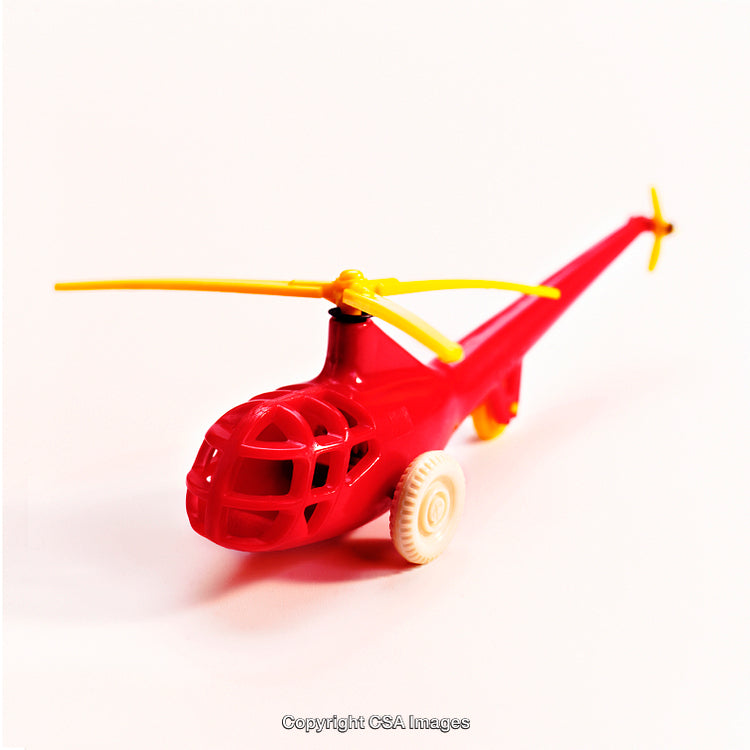 Red Plastic Toy Helicopter with Yellow Blades on White Background