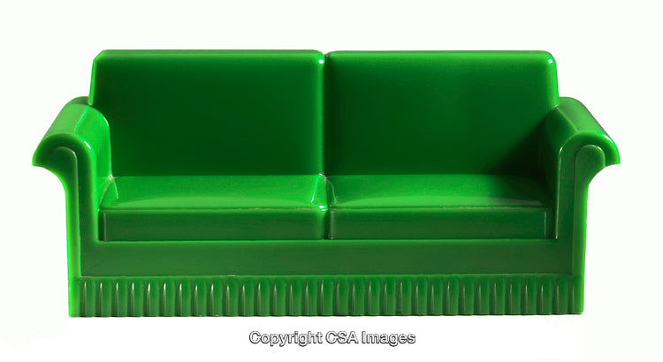 Bright Green Miniature Plastic Sofa on a White Background