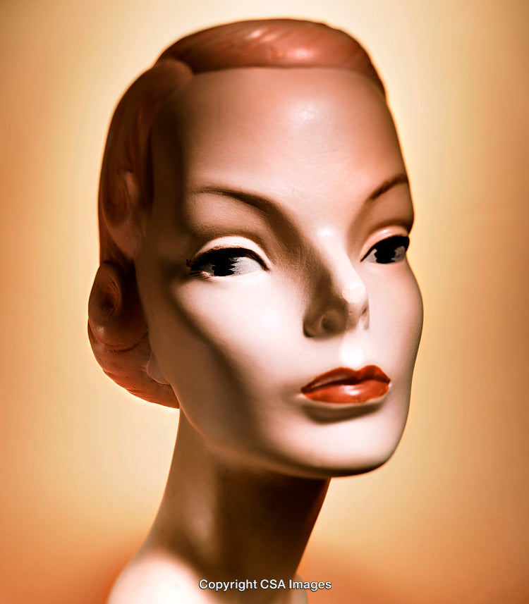 Vintage Female Bust Against Warm Toned Backdrop