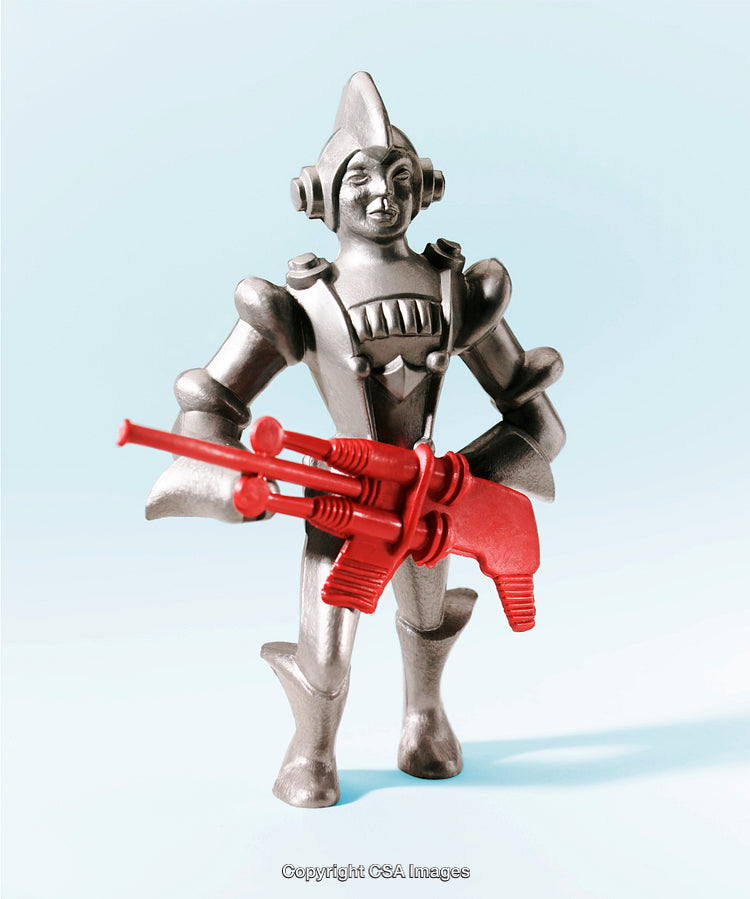 Retro Robot Toy Holding Red Weapon on a Light Background