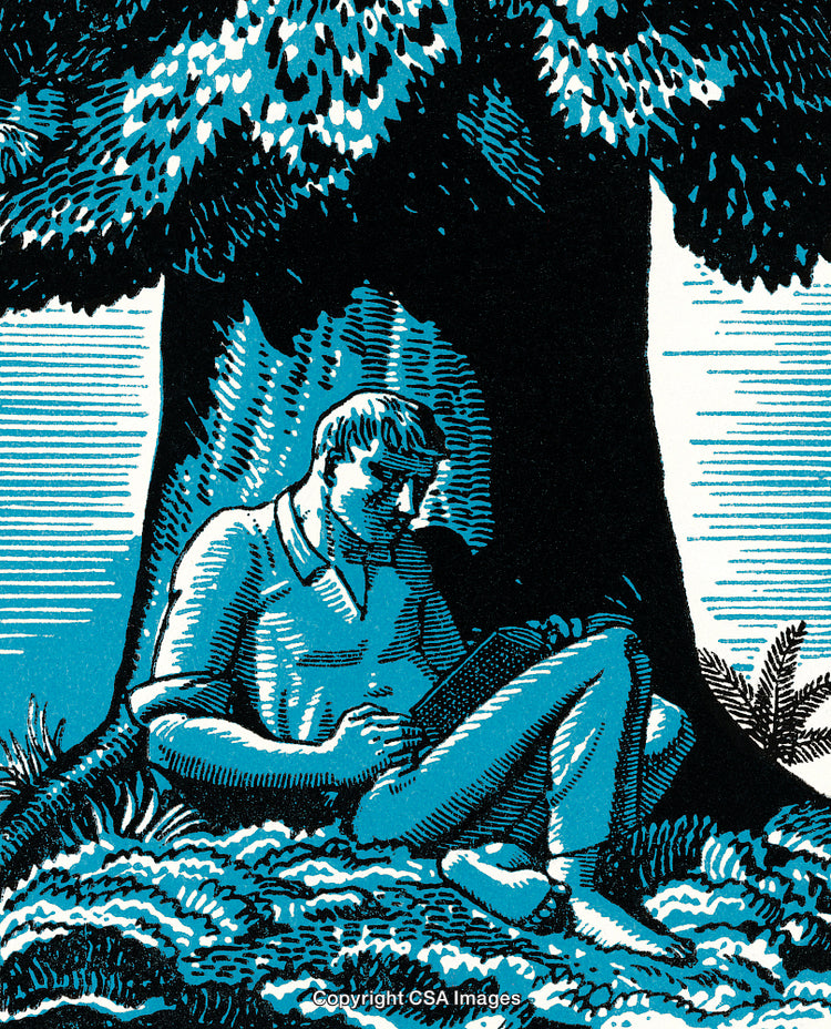 Man Relaxing and Reading a Book Under a Large Tree