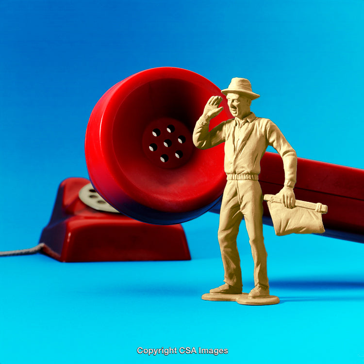 Toy Figure Beside Vintage Red Telephone on Blue Gradient Background