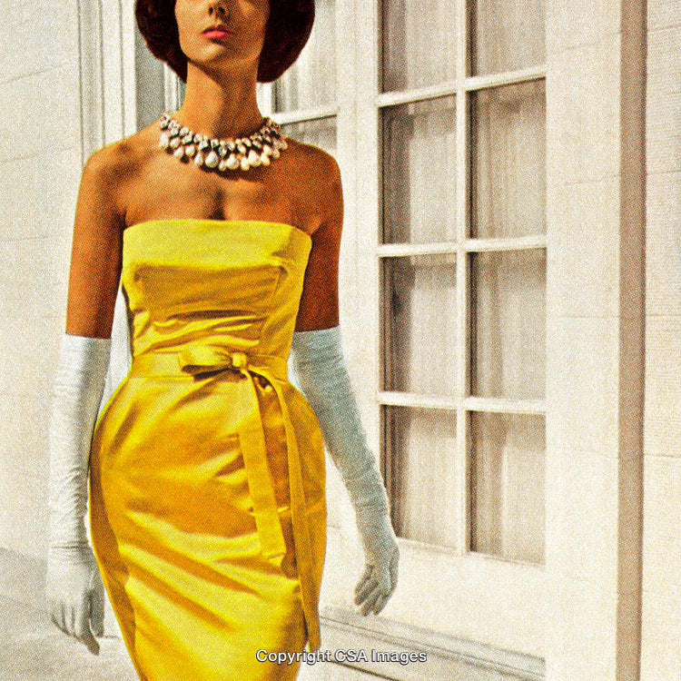 Elegant Woman Wearing Yellow Dress with Gloves and Necklace Outdoors