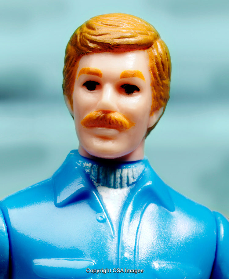 Closeup of a Mustached Male Plastic Figurine in Bright Colors
