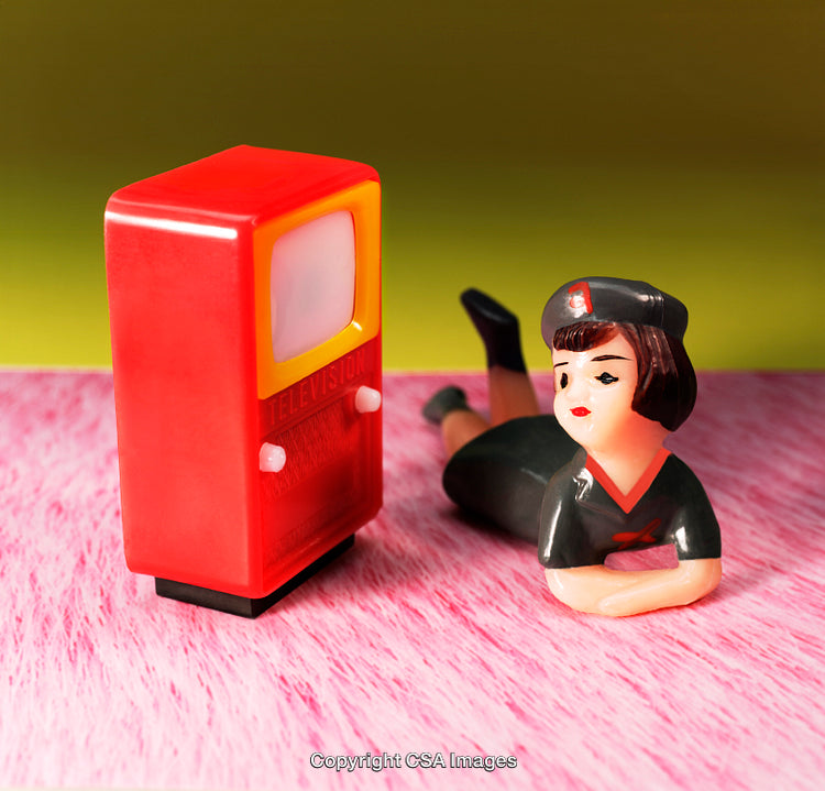 Vintage Plastic Figurines Displaying a Nostalgic Retro Television Scene