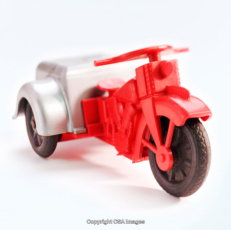 Close-Up of a Red Plastic Toy Motorcycle with Sidecar