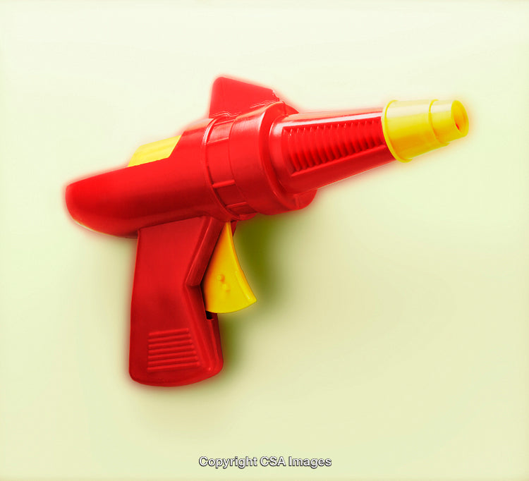 Red and Yellow Toy Blaster Against a Light Background