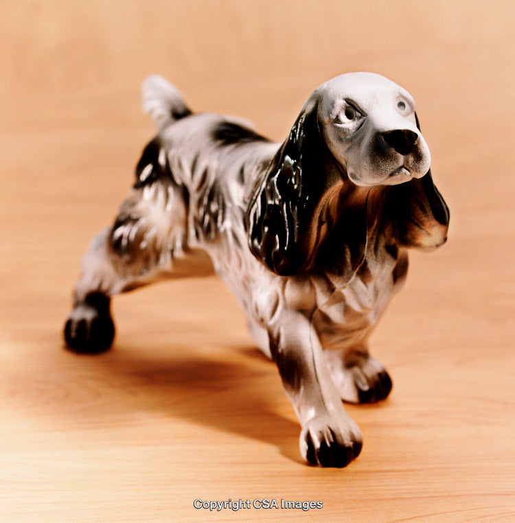 Detailed Ceramic Dog Figure Displayed on Wooden Surface for Decorative Use