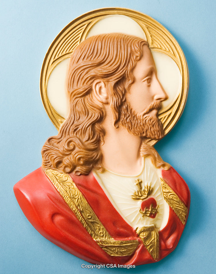 Religious Figurine Depicting Sacred Heart Icon Set Against Blue Background