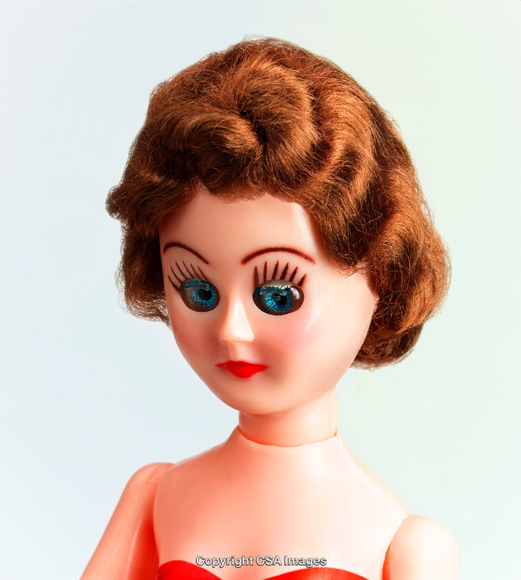Red-Haired Retro Doll with Blue Eyes in Up Close Portrait