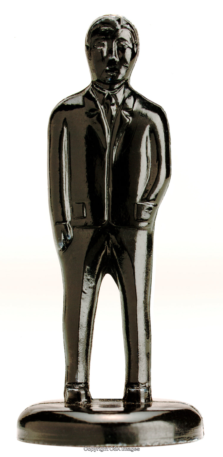 Black Figurine Depicting a Businessman Standing in a Suit and Tie