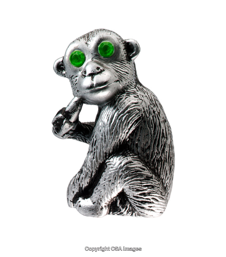 Metal Monkey Figurine with Green Eyes Reflecting Creativity and Art