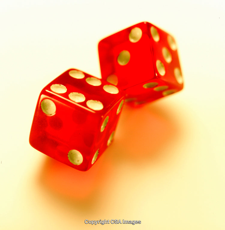 Closeup of Vibrant Red Dice on a Light Background