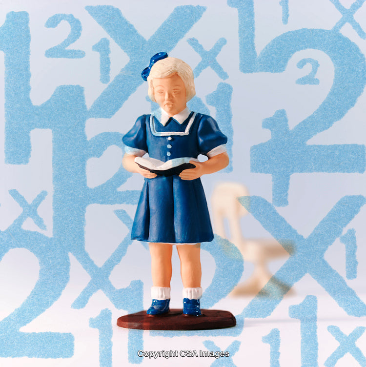 Colorful Toy Figurine of a Child Reading with Educational Background Elements