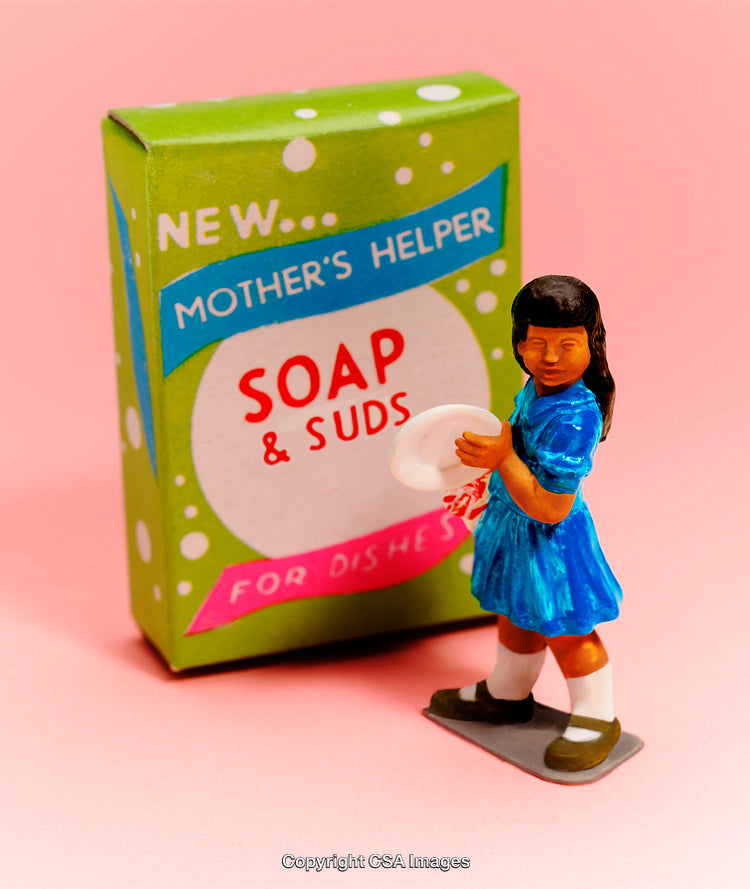 Miniature Figurine with Soap Box Against Pink Background