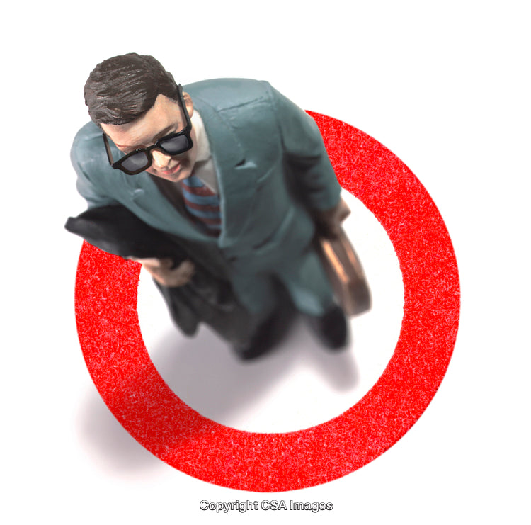 Top View of Businessman Figure Standing Inside a Red Target Symbol