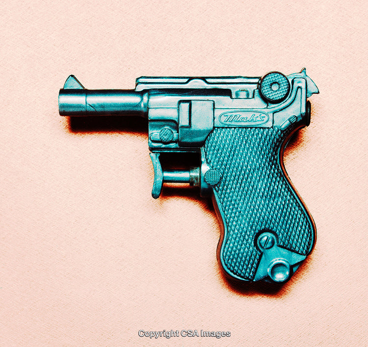 Vintage Style Toy Gun on Pastel Background