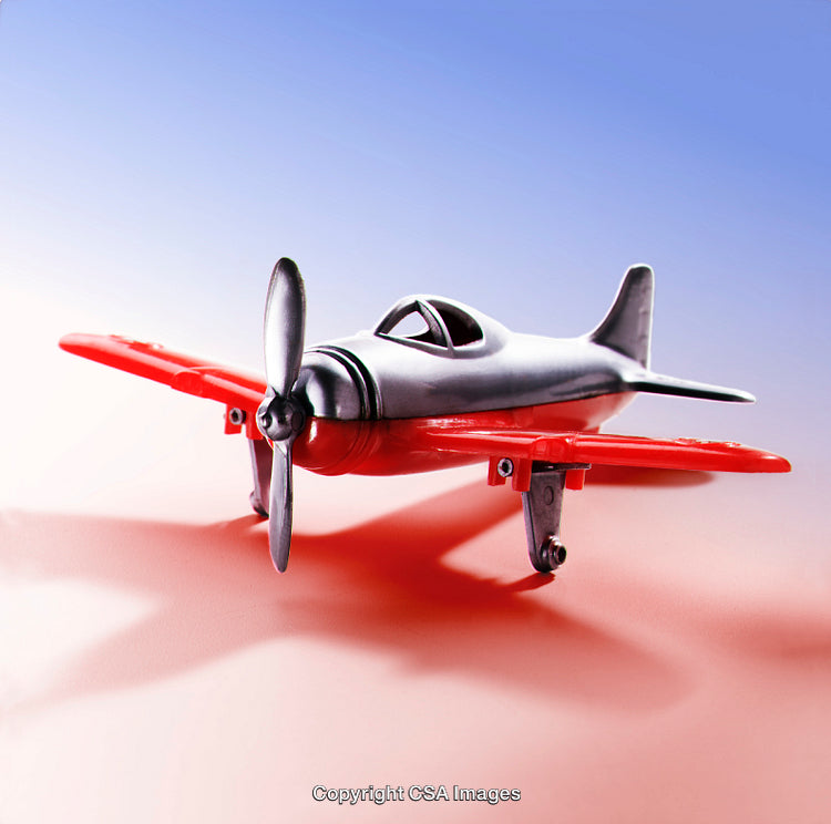 Small Propeller Airplane Model on a Vibrant Gradient Background