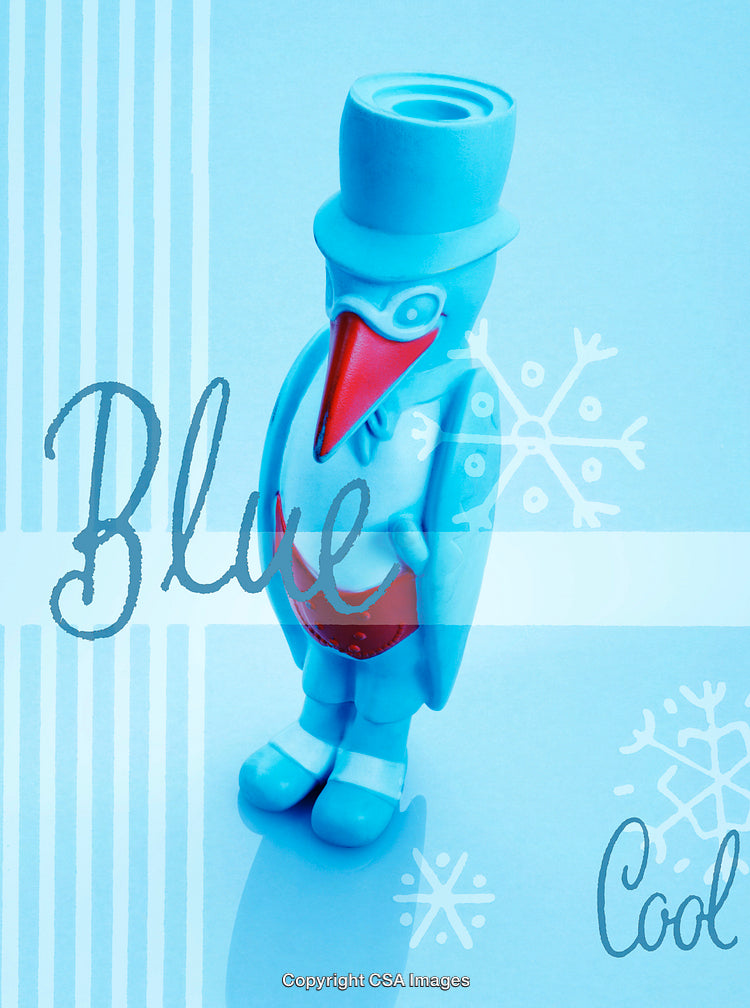 Blue Plastic Penguin Figure in Winter-Themed Background with Snowflakes