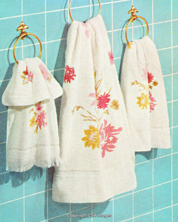 Vintage Styled Embroidered Towels on a Retro Wall Background