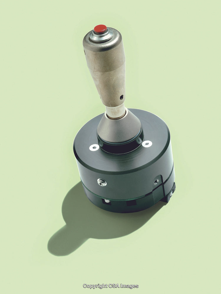 Vintage Joystick Controller on Simple Green Background Isolated Closeup