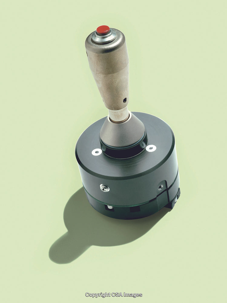 Vintage Joystick Controller on Simple Green Background Isolated Closeup