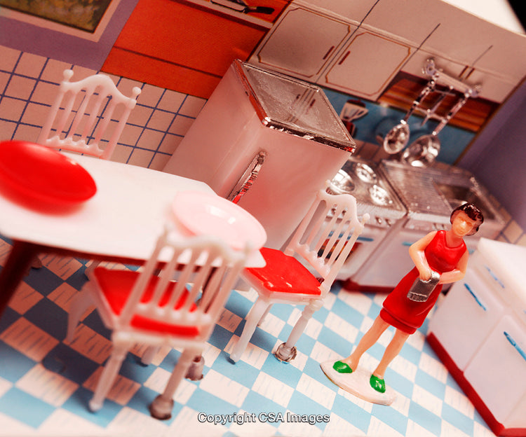Miniature Kitchen Scene with Plastic Figures and Furniture in Vibrant Red Accents