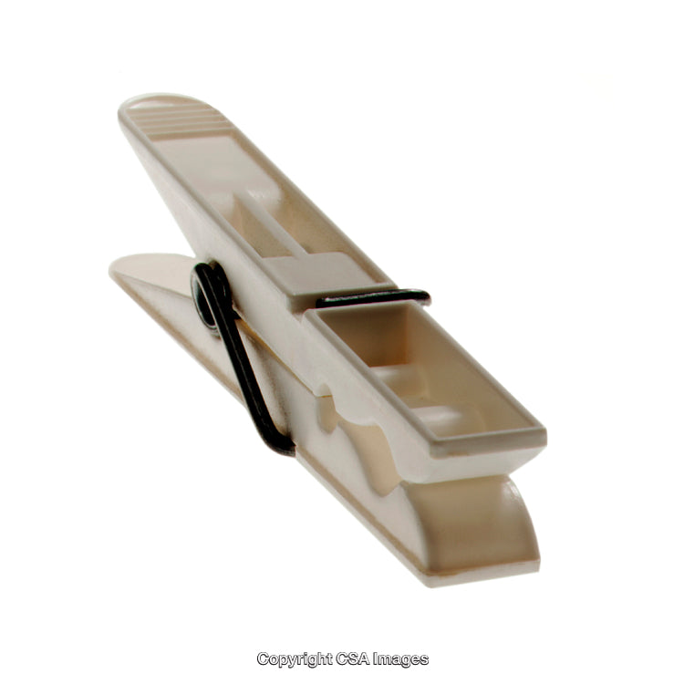 Close-Up of a Beige Plastic Clothespin on White Background