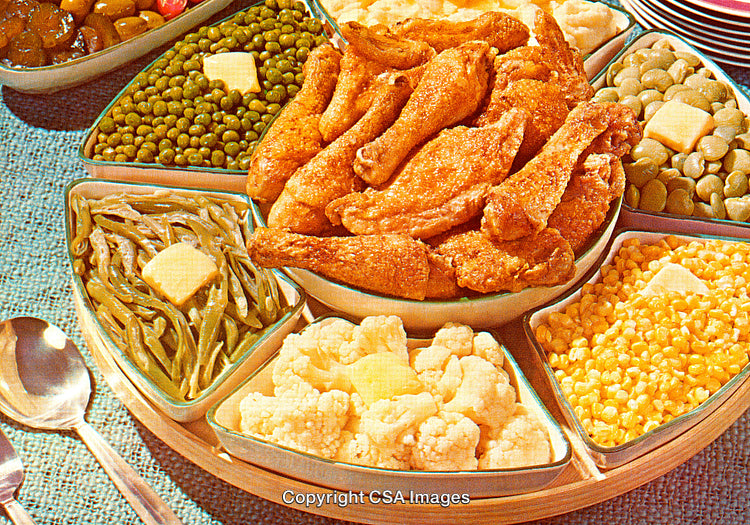 Delicious Family Style Dinner with Fried Chicken and Vegetable Sides