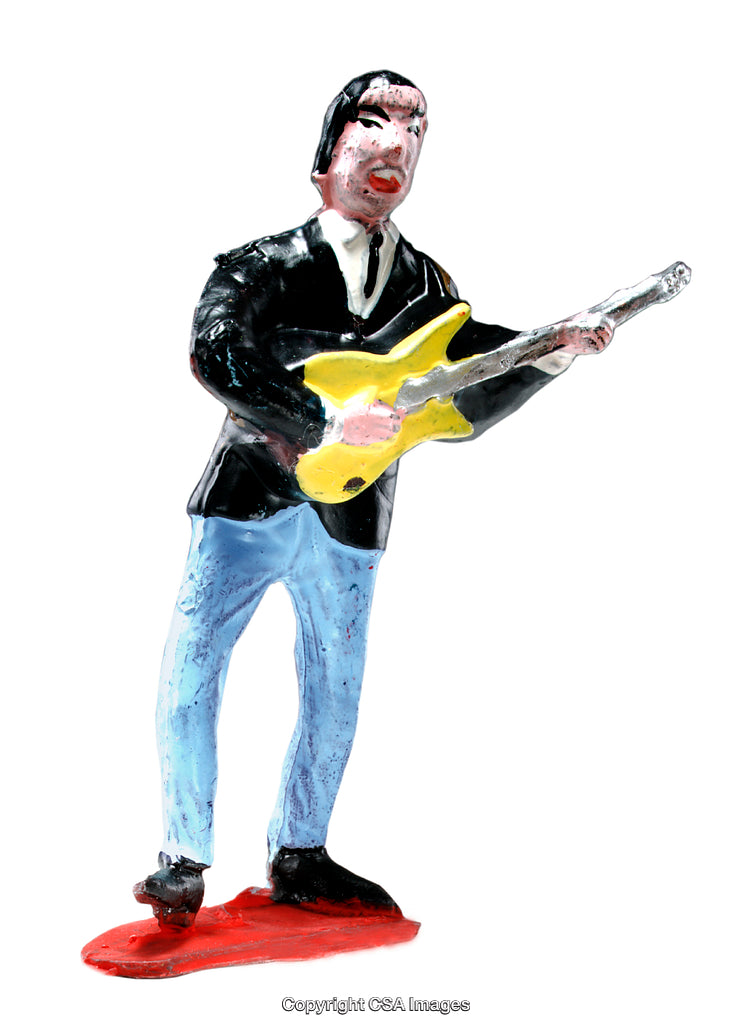 Colorful Toy Figure of a Musician Playing a Yellow Electric Guitar