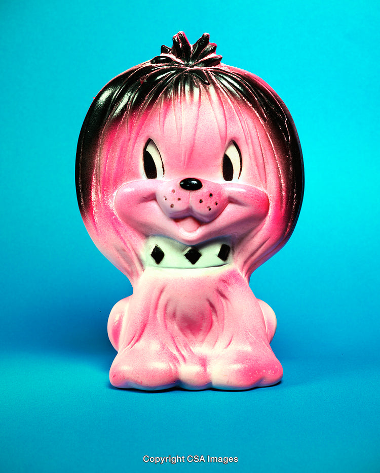 Colorful Vintage Plastic Toy Lion Figurine on Blue Background