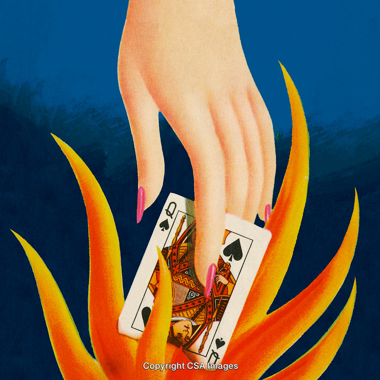 Hand Holding Queen of Spades Card Amid Artistic Flames