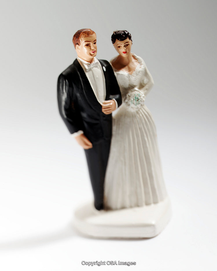 Vintage Bride and Groom Figurines Depicting Wedding Celebration