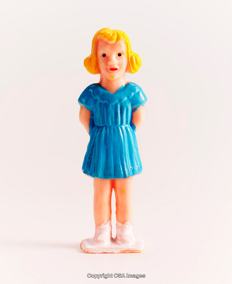 Vintage Female Figurine in Blue Dress on Neutral Background