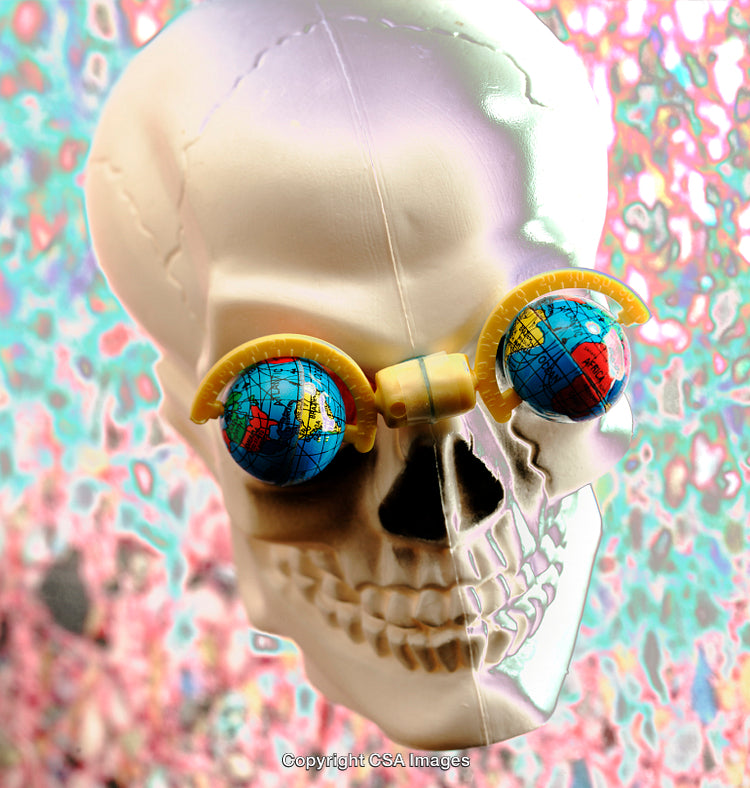 Plastic Skull With Globes as Eyes on Vibrant Abstract Background