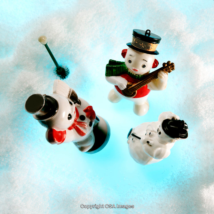 Festive Snowman Figurines Display in a Glowing Winter Scene