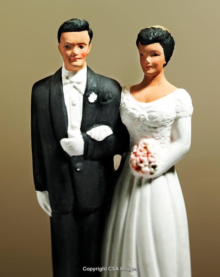 Vintage Wedding Cake Topper Featuring Bride and Groom Figurines