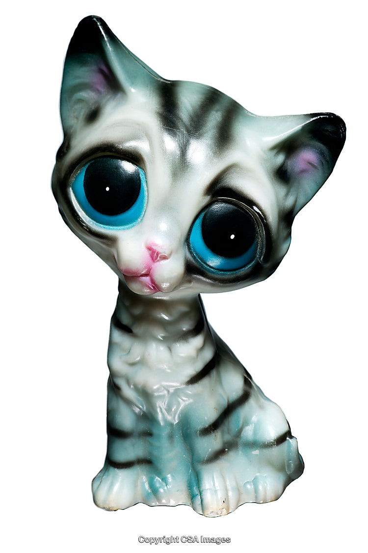 Close-Up of a Cute Plastic Cat Figurine with Big Blue Eyes