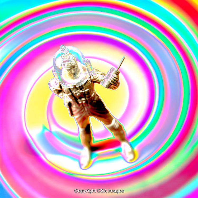 Colorful Astronaut Toy Figure Surrounded by Vibrant Hypnotic Background