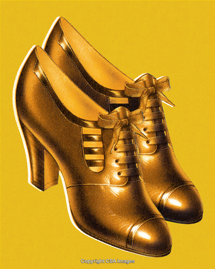 Elegant Vintage High Heel Shoes With Laces in Golden Hues on Yellow Backdrop