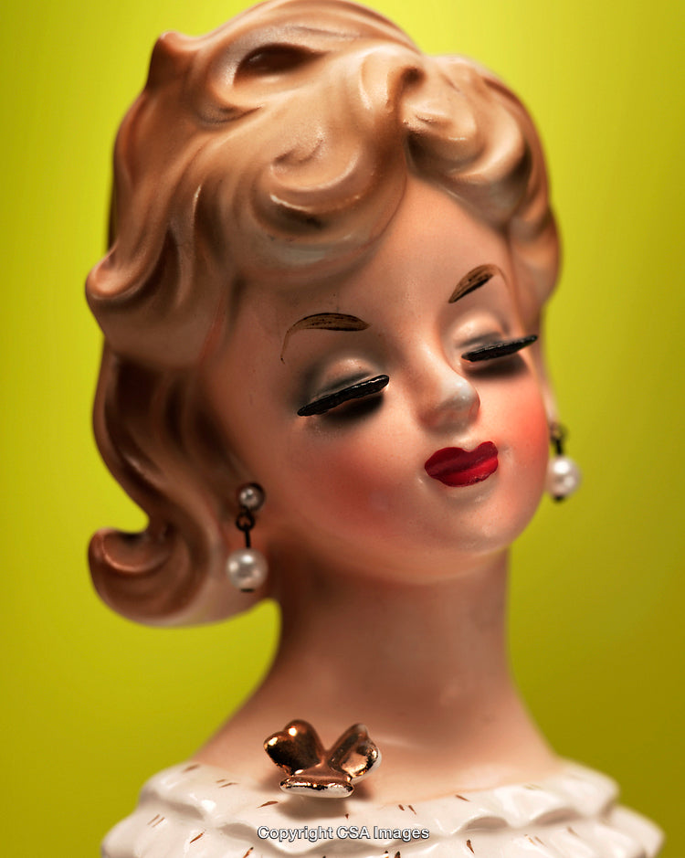 Elegant Vintage Figurine with Graceful Details on Vibrant Background