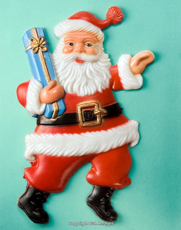 Santa Claus Figurine Holding Gift on Turquoise Background