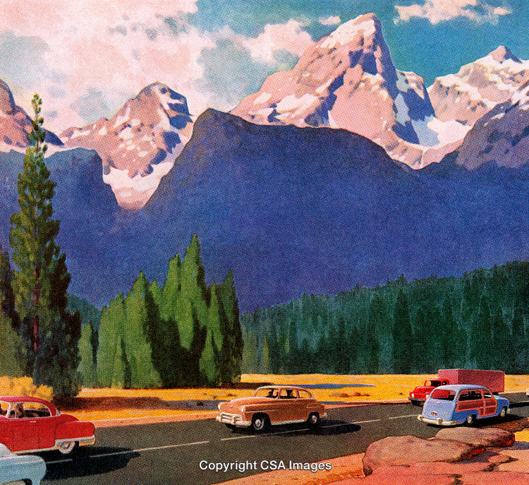 Vintage Highway Scene with Vehicles Against Majestic Mountain Backdrop