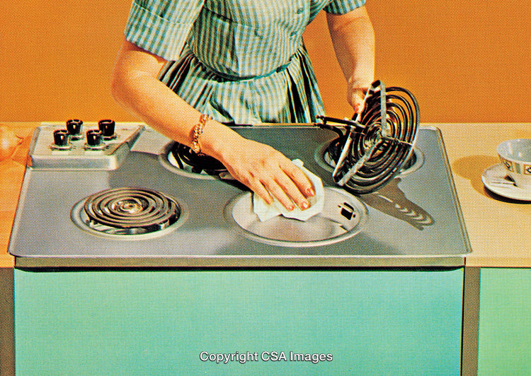 Woman Cleaning Retro Stovetop in Stylish Vintage Kitchen Setting
