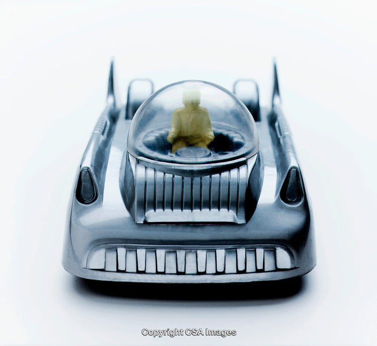 Vintage Toy Car with Futuristic Design and Driver Inside Dome