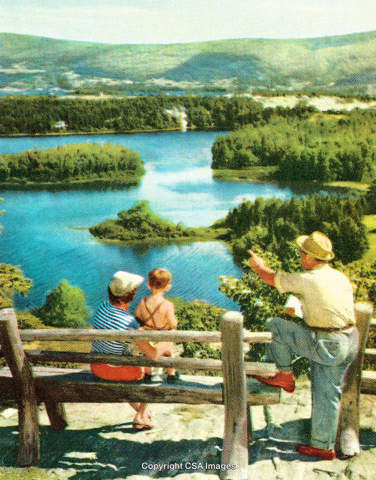 Family Enjoying Scenic Lake View From a Wooden Bench Overlook