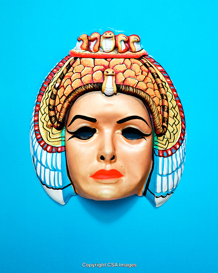 Vibrant Egyptian-Style Mask With Cobra Design on Bright Blue Background