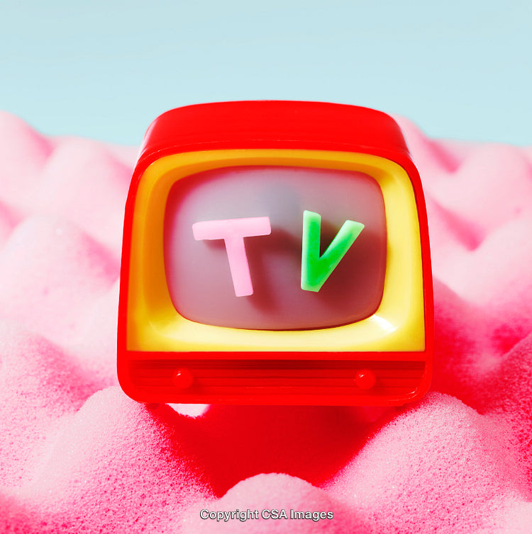 Colorful Retro Toy Television on Bright Pink Plush Background